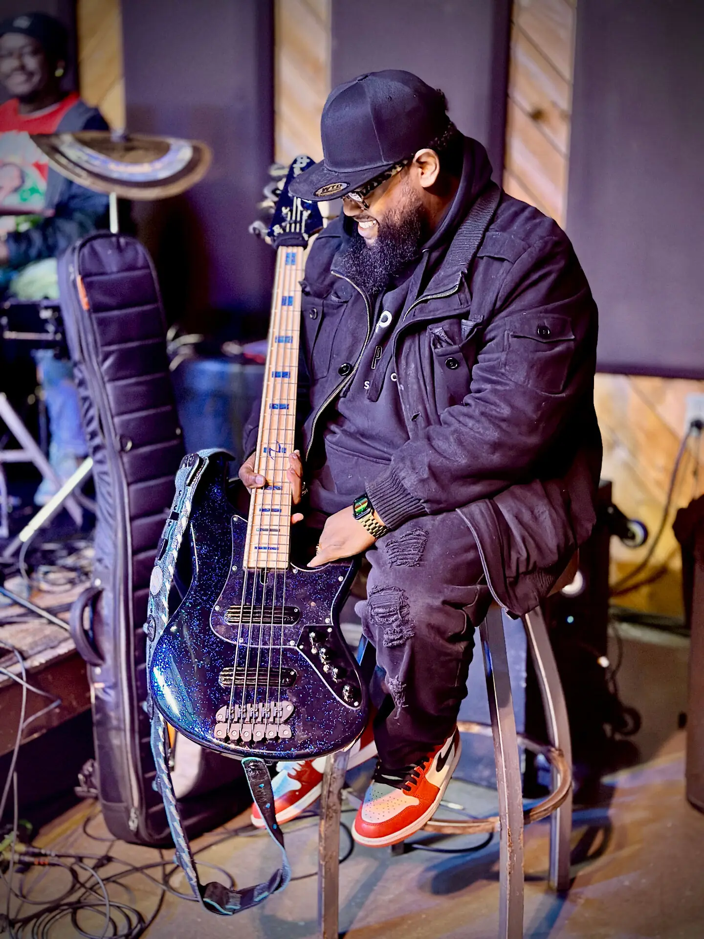 Benjamin Parker with custom blue sparkle bass guitar