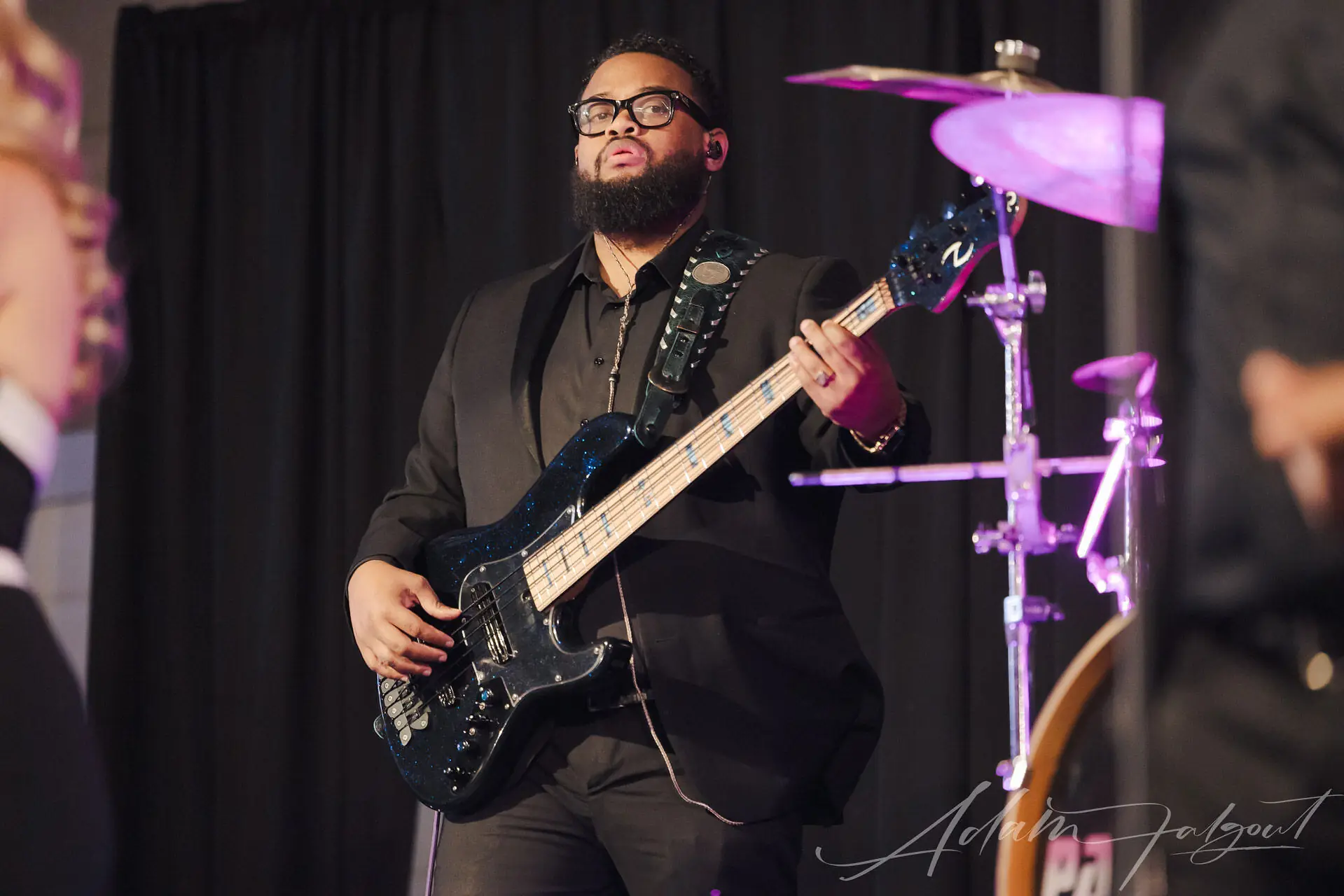 Benjamin Parker on stage with band